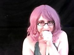 Coco smoking with pink hair and glasses